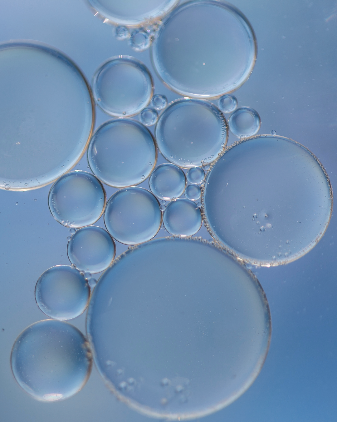 Close-up of clear bubbles on a blue background